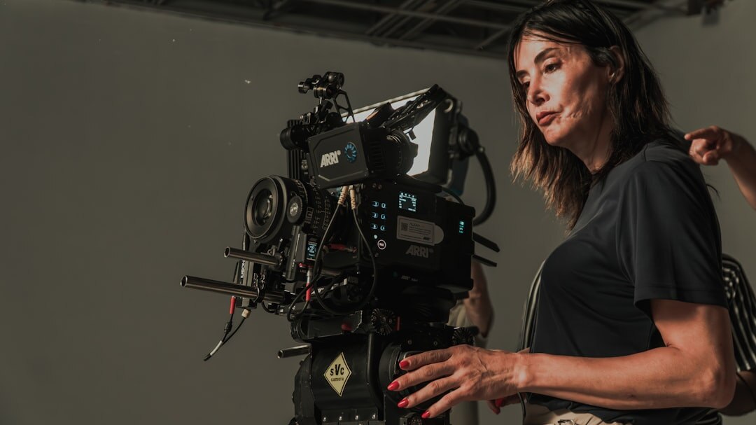 Portrait of a young female camera link engineer in a studio
