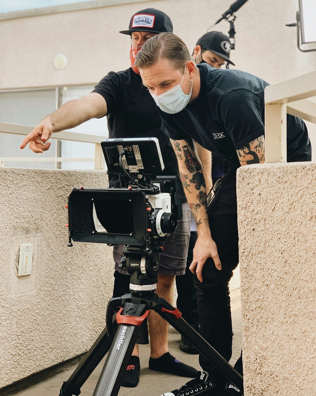 Camera crew setting up a fiber camera link for a live broadcast