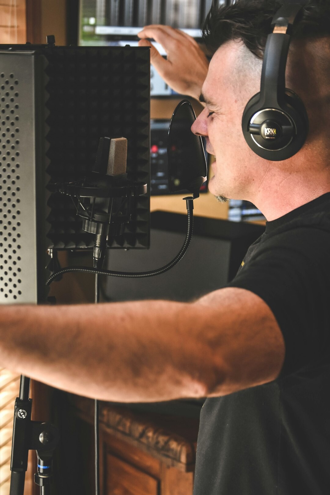 Technical director wearing a headset monitoring live broadcast feeds in a control room
